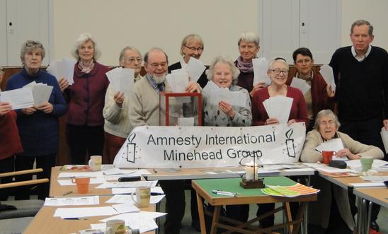 Amnesty members holding letters Amnesty members holding letters